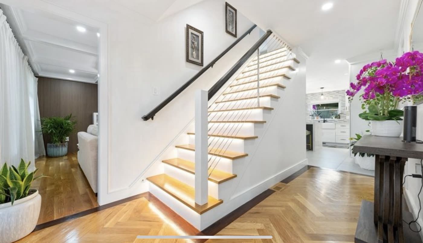 The foyer and floating staircase